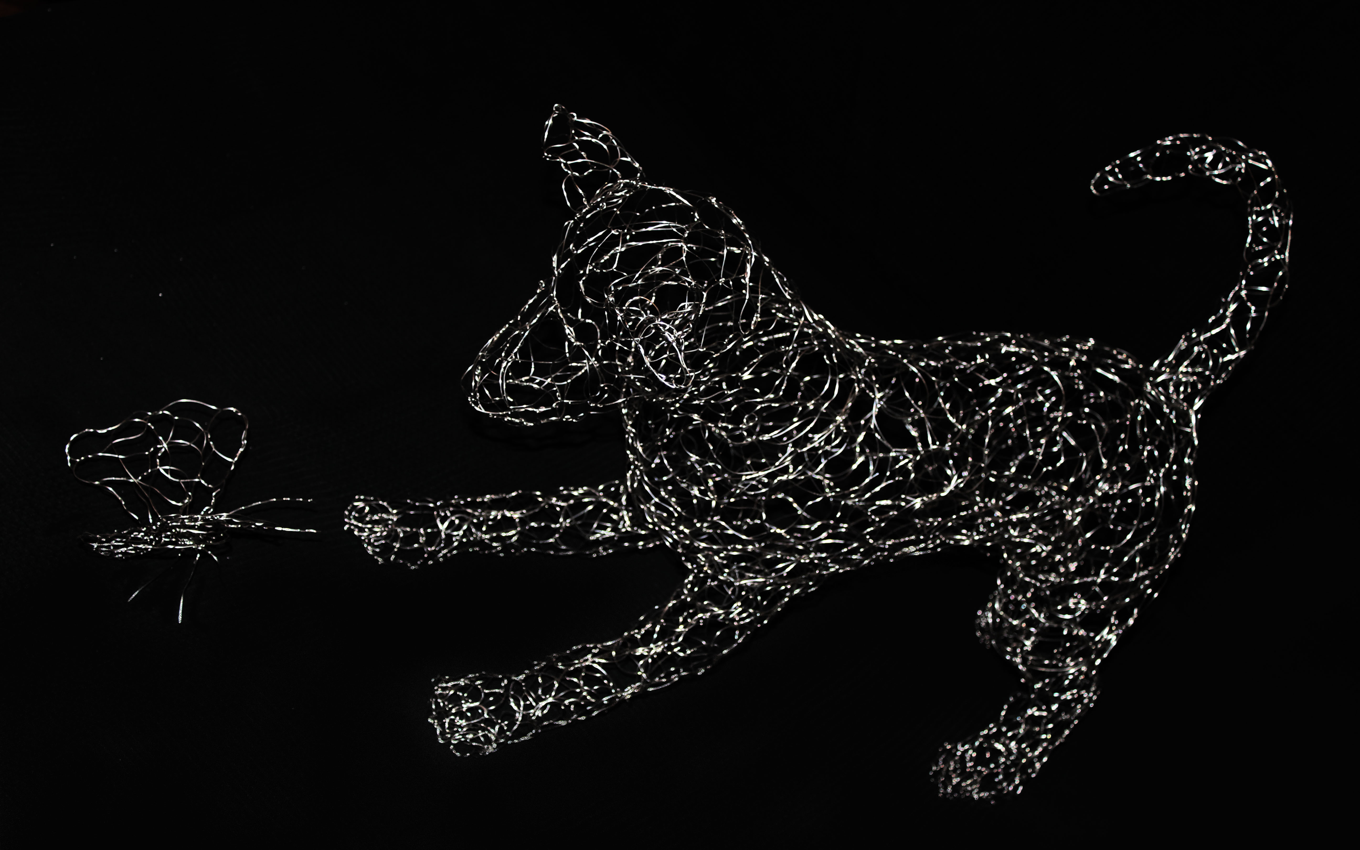 "Giochiamo? - Il cane e la farfalla" Woven stainless steel sculpture, cm 50 x 67 x 25 - cm 13 x 15 x 15, 2015 Unique Piece
